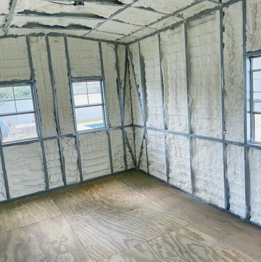 Closed-cell spray foam insulation applied to wall cavities in a residential project in Greenville